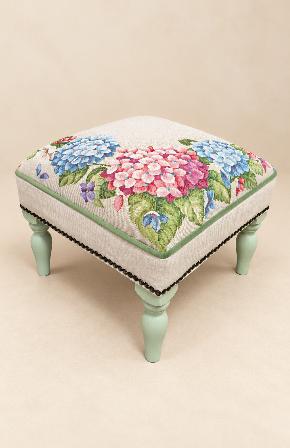 Floral upholstered footstool